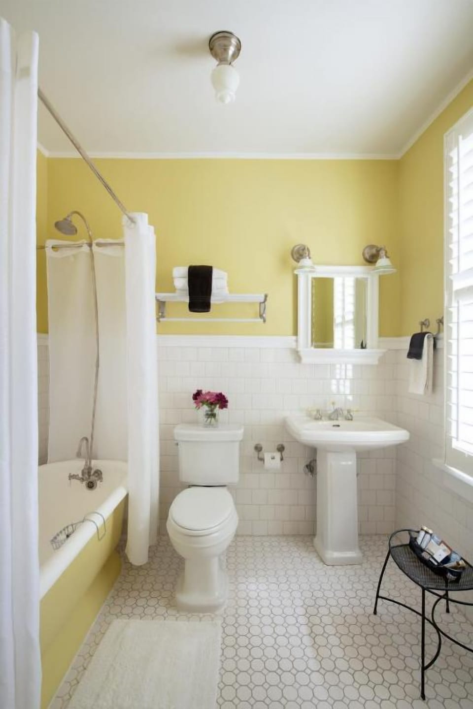 Start your day refreshed in a bright, classic tiled bath.