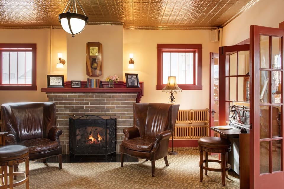 Cozy up by the crackling fireplace with a quiet nightcap.