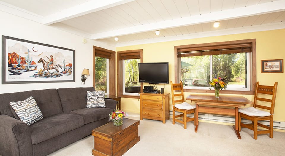Gather for meals and conversation in this sunny lounge.