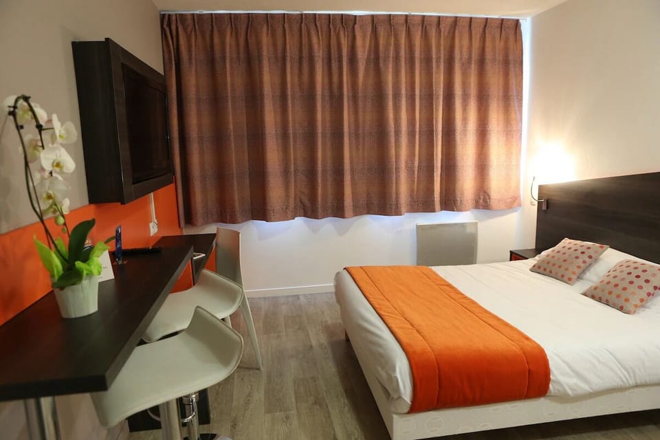 Settle in for restful nights with warm lighting and plush bedding.