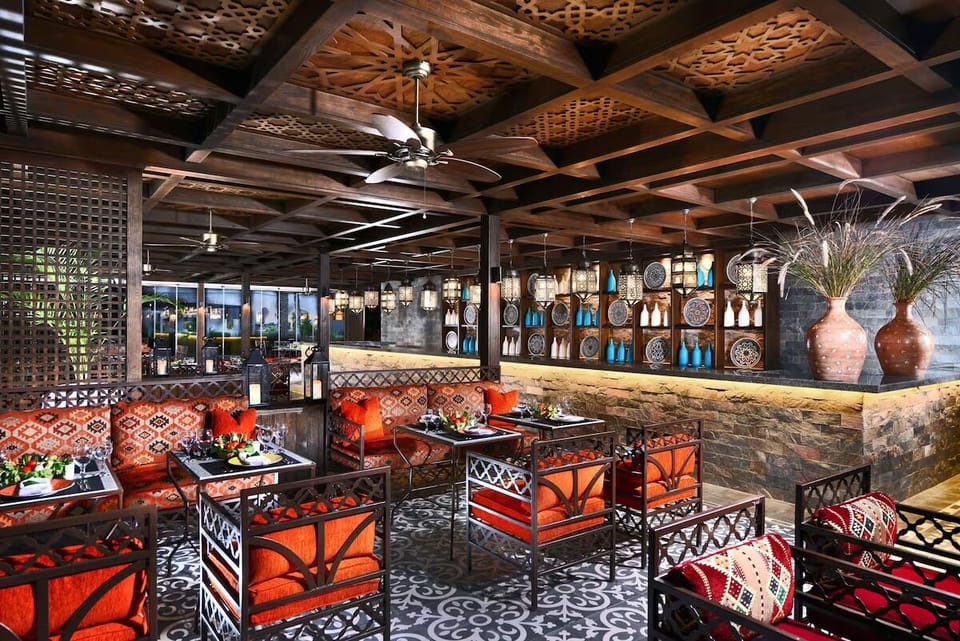 Dine under warm lantern light in a vibrant setting.