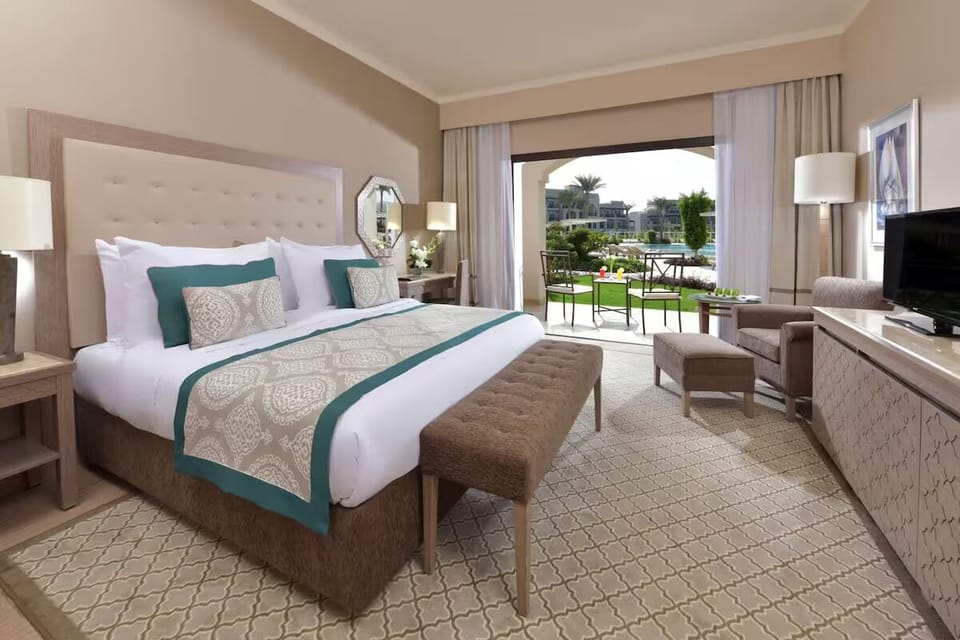 Sink into crisp linens and enjoy garden terrace serenity.