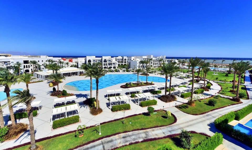 Soak up resort vibes with panoramic pools and gardens below.