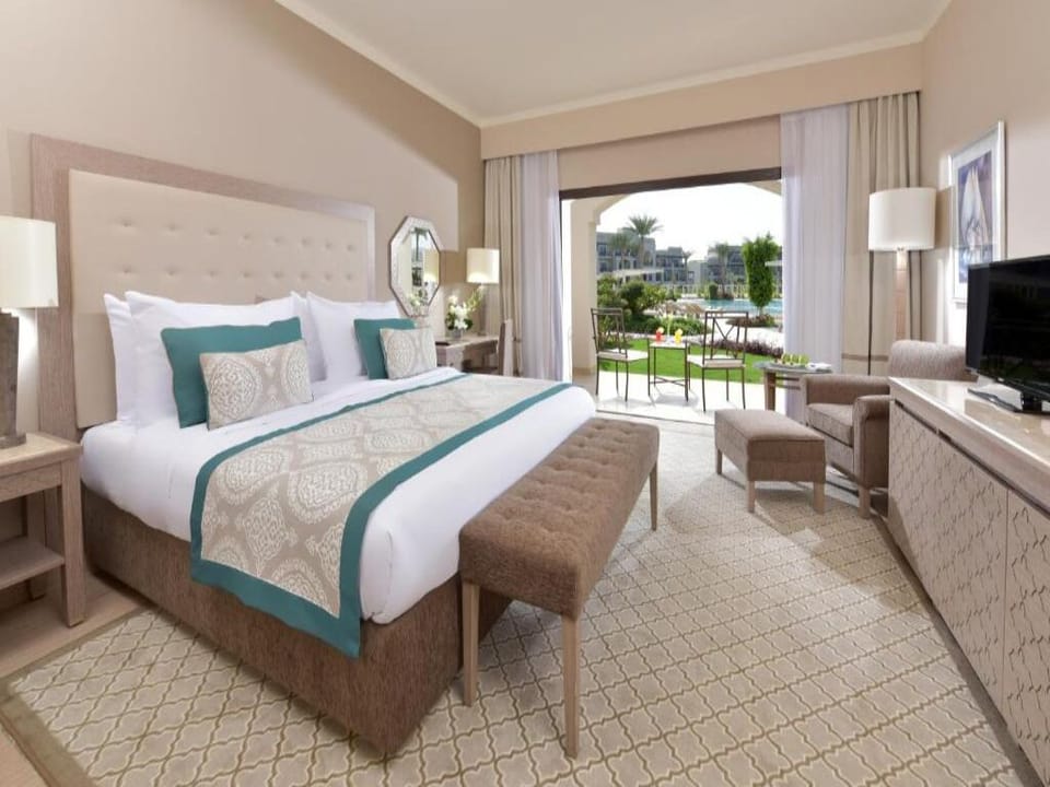 Sip morning coffee while garden views frame your king bed.