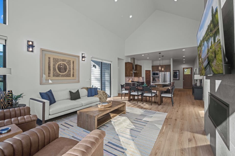 Your modern open-concept living space flows effortlessly from cozy seating to the gourmet kitchen, perfect for gathering and making memories together.