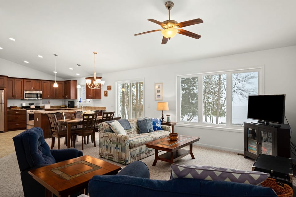 Open-concept living room with lake views and cozy seating