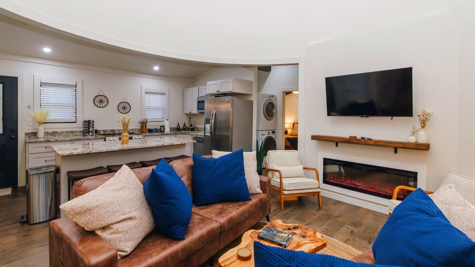 All the comforts of home, and then some. Enjoy a movie on the large TV, cozy up by the electric fireplace, and appreciate the convenience of the in-unit stacked washer and dryer tucked away in the corner.