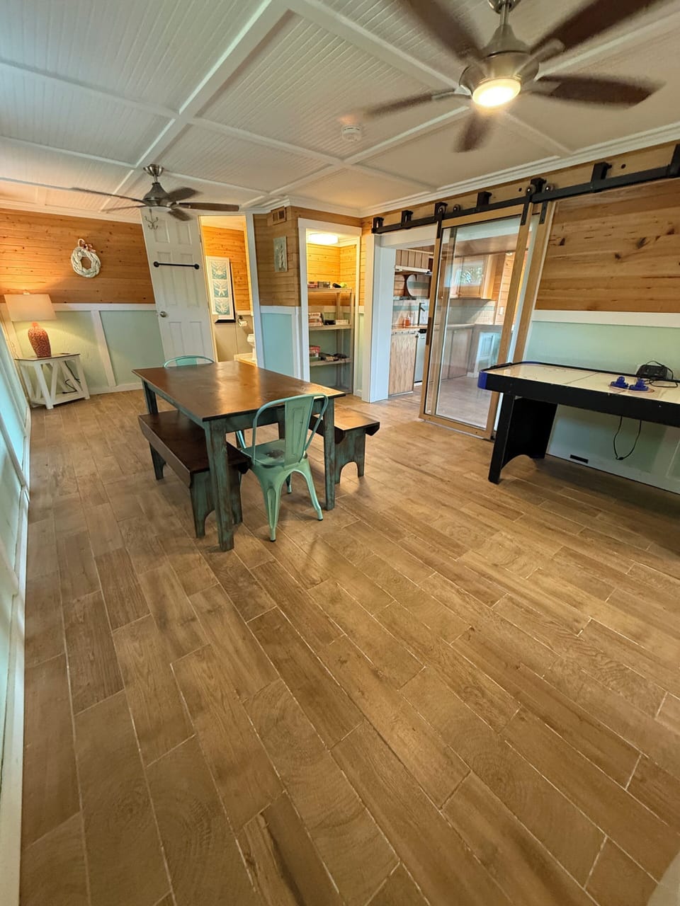 Downstairs game room with air hockey, board games, and puzzles