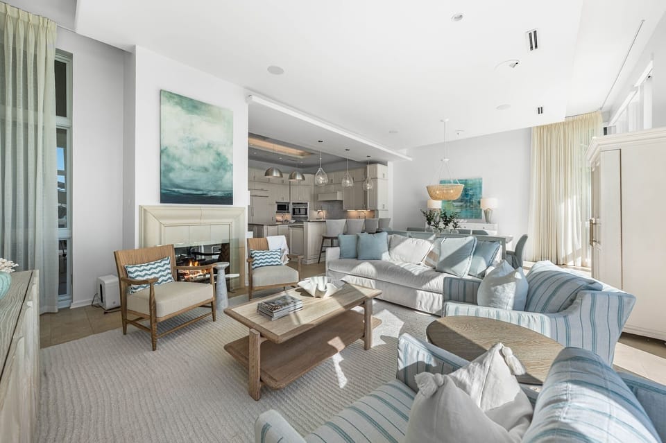 Sink into plush coastal-inspired seating where soothing blues and natural textures create your perfect retreat for relaxation and gathering.