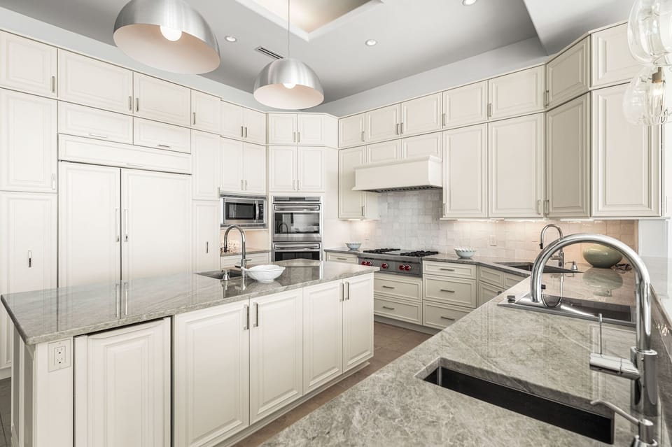 Your gourmet kitchen awaits with gleaming granite countertops, premium stainless appliances, and endless storage for memorable meal preparations.
