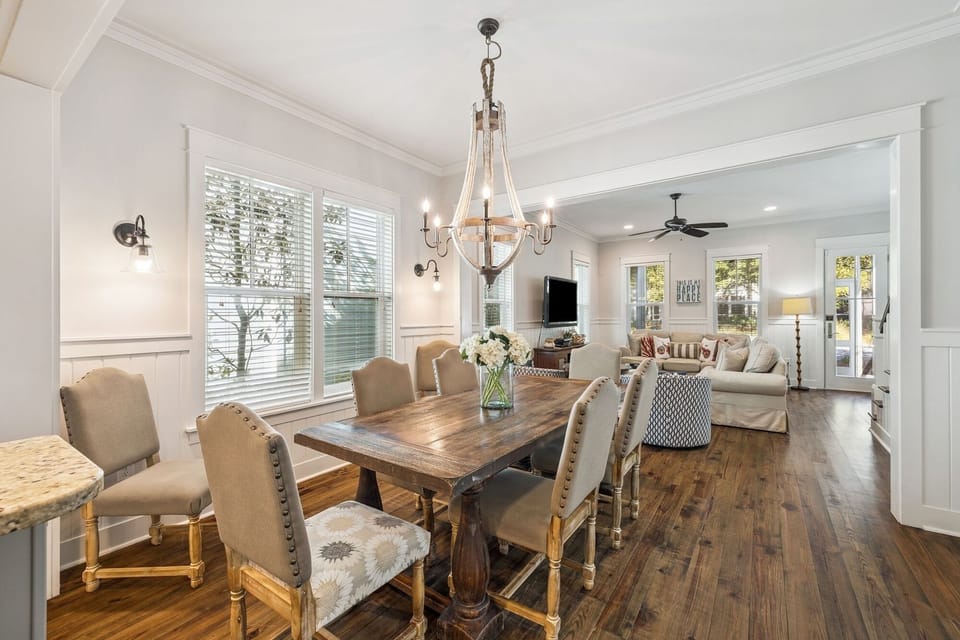 Gather around your elegant dining table beneath the statement chandelier, then relax in your spacious living room.