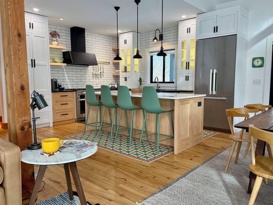 Gourmet Chef’s Kitchen with Miele Appliances and Island Eating