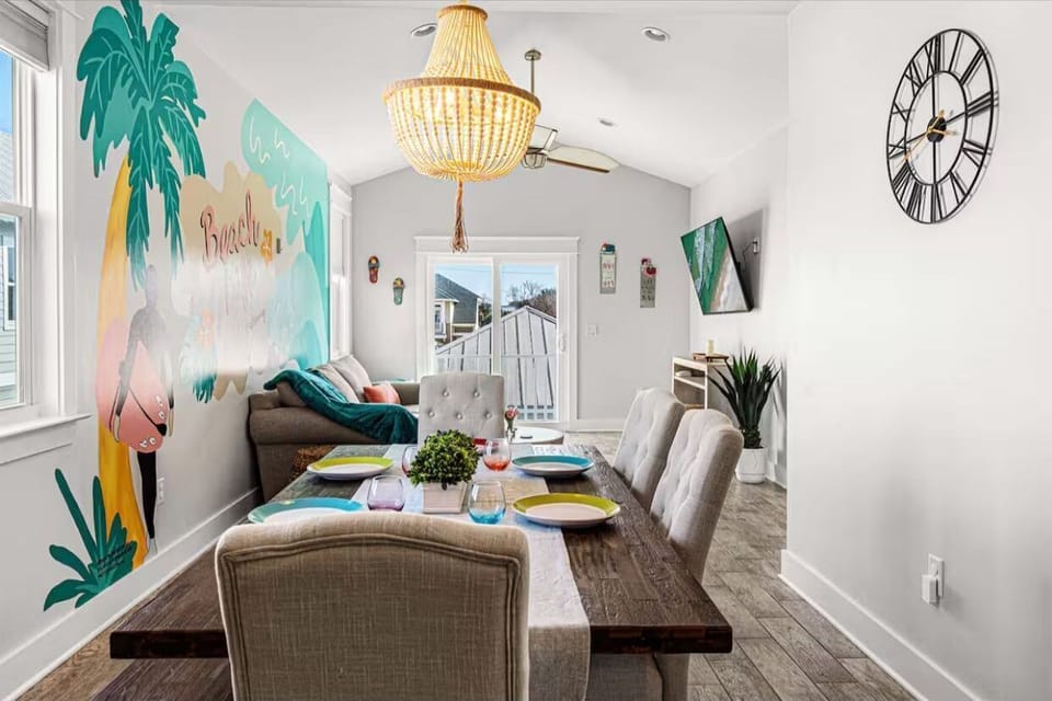 Long meals and good conversations happen naturally around this table under soft lighting 