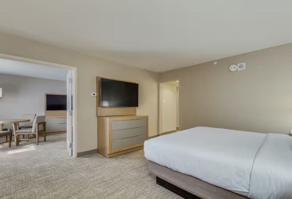 Kick back and enjoy a spacious layout with wall-mounted TV.