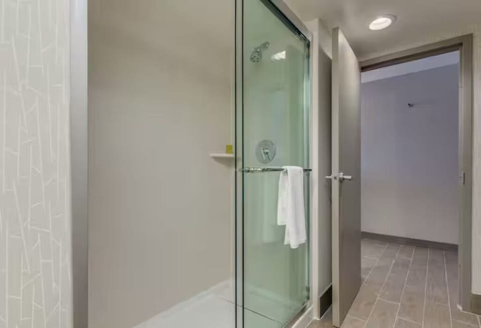 Rinse off in a sleek glass shower after busy days.