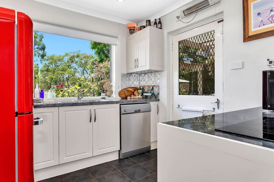 Bright kitchen workspace with generous bench space and garden outlooks.