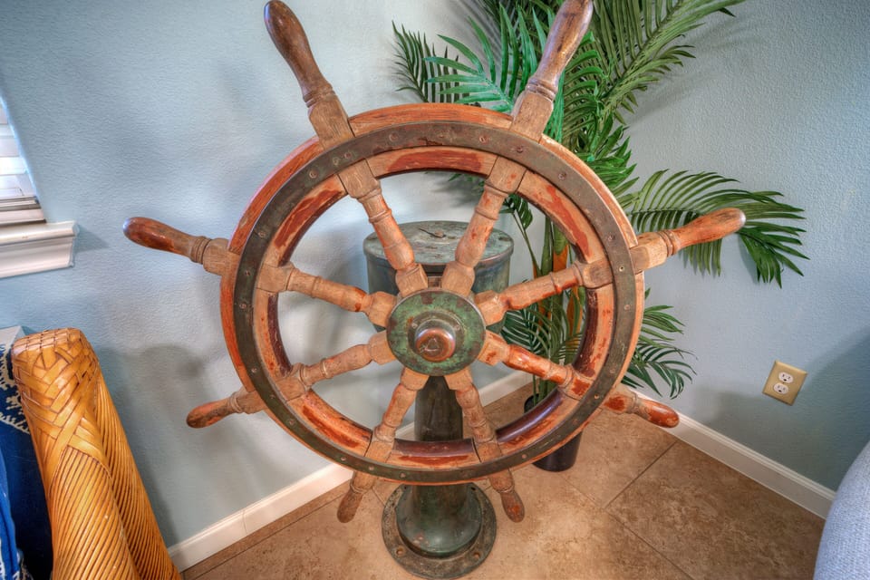 Close-up of decorative nautical ship wheel.