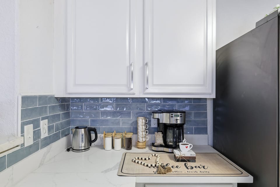 2-Way drip coffee machine with complimentary coffee, decaf, tea, sugar, cream, and sweetener