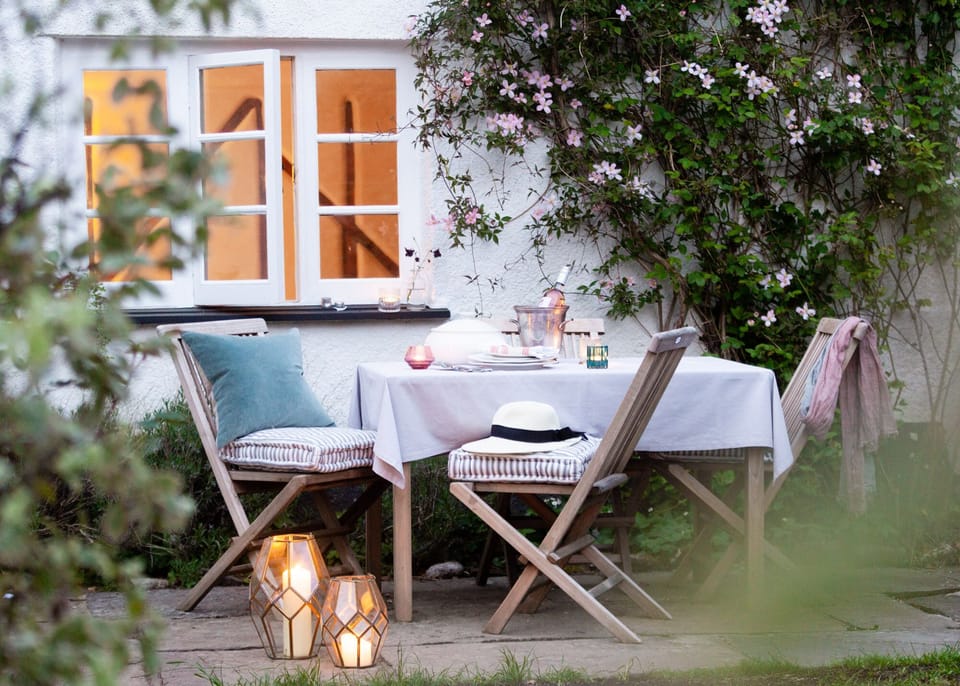 Outdoor dining on the cottage terrace