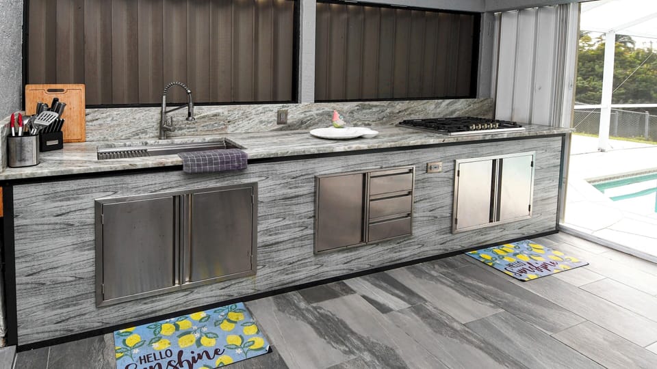 Fully equipped outdoor kitchen adds comfort and enjoyment to shared cooking moments on vacation