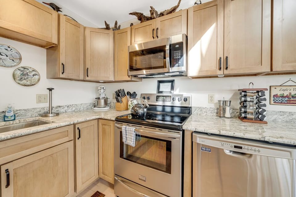 Stainless Appliances and warm wood cabinetry.