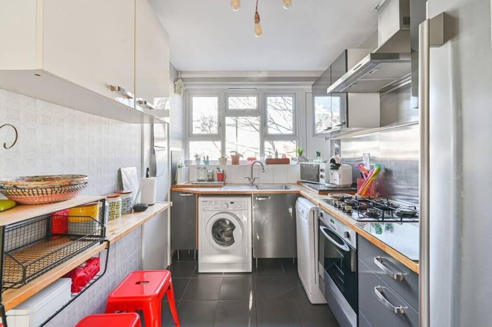 Kitchen: Bright and modern, perfect for culinary adventures with stylish seating!