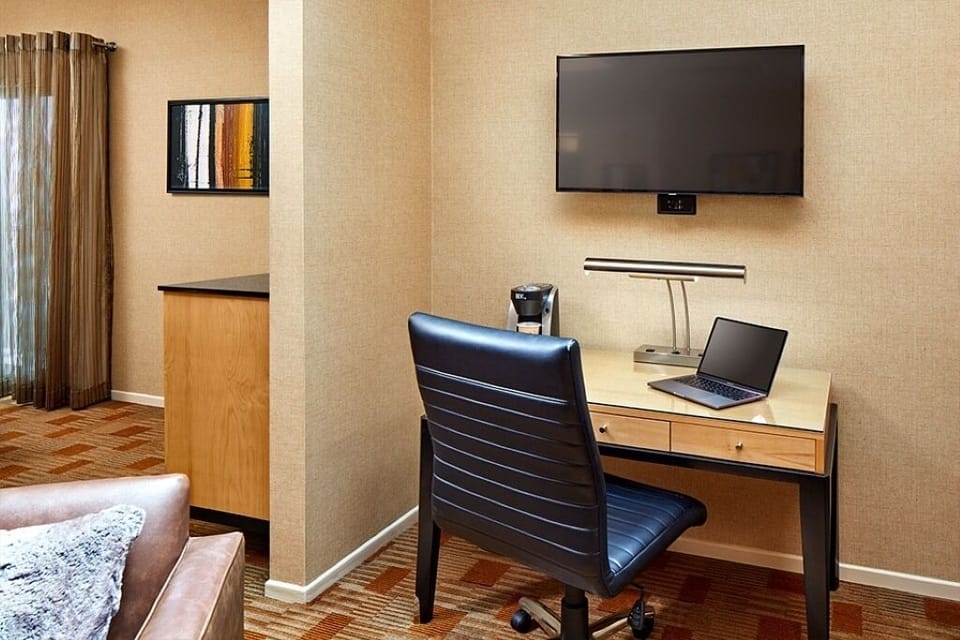 Settle in and power through emails at the dedicated desk.
