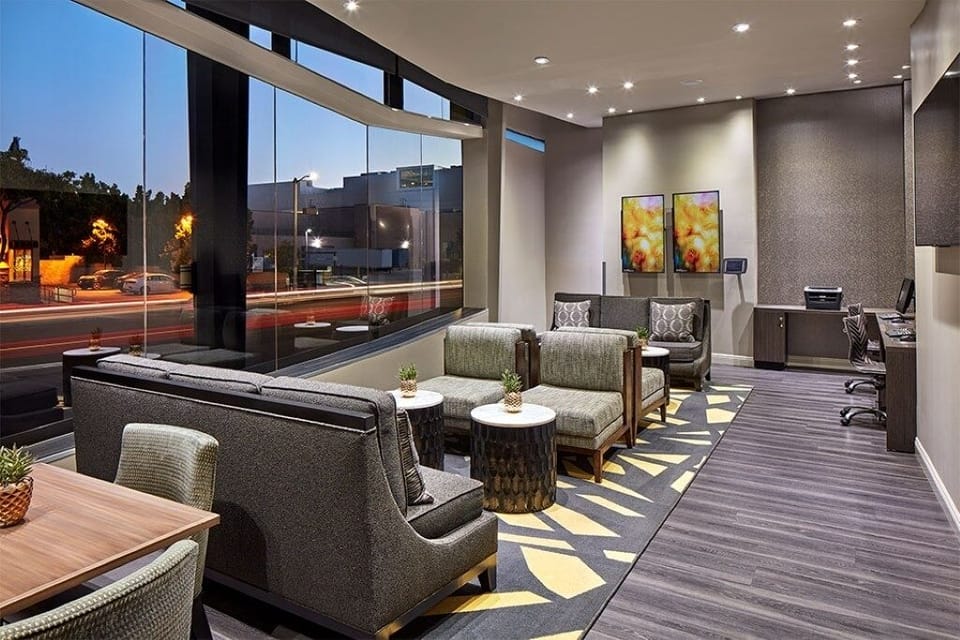 Recharge in the light-filled lounge with sweeping street views.