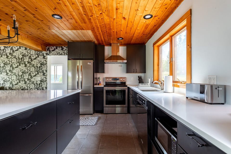 Large kitchen with new stainless steel appliances
