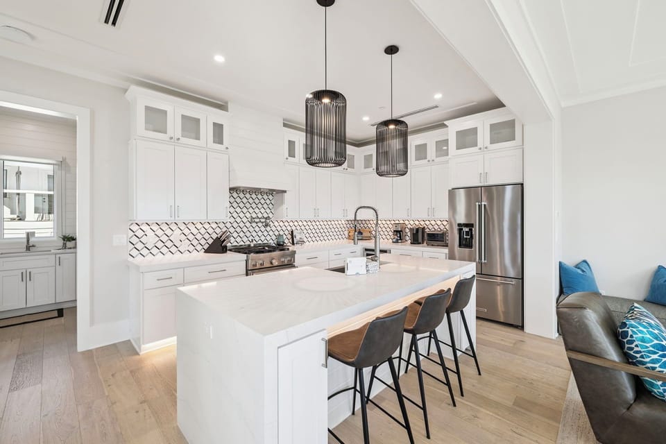 Your stunning kitchen welcomes you with gleaming marble counters and stylish pendant lights, perfect for cooking memorable meals together.