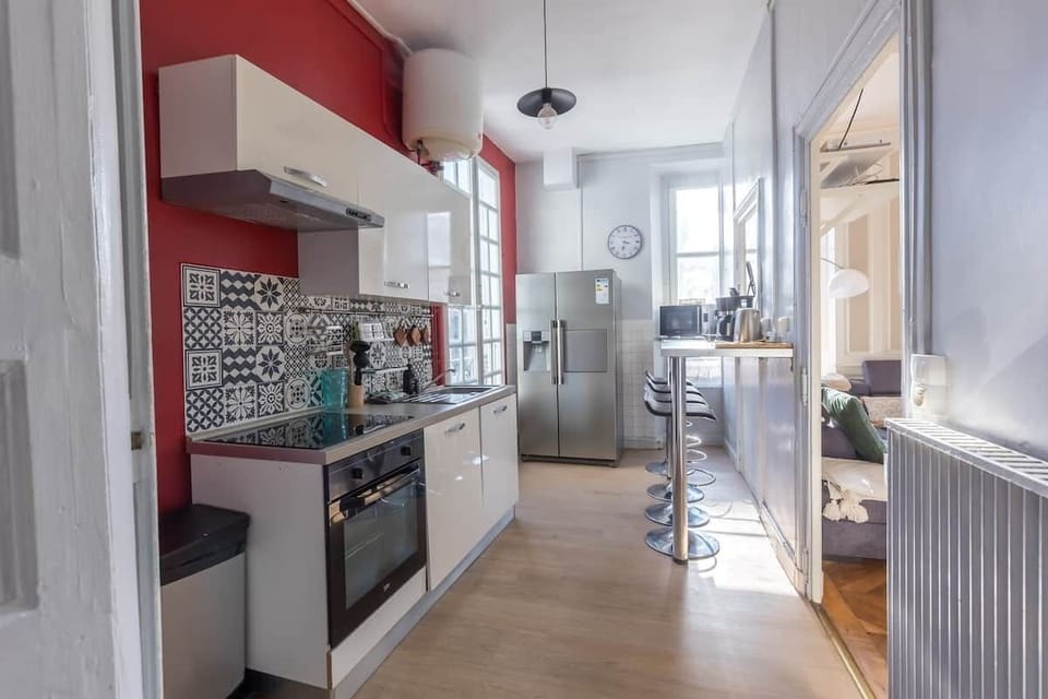 First-floor kitchen with American-style refrigerator, appliances, raclette grill, etc. | VillaBarillerie1870 Le Mans