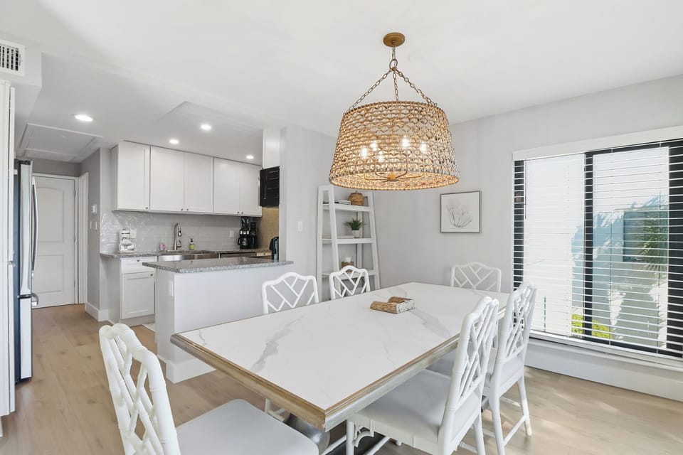 Dining room leads to kitchen and also opens to back deck
