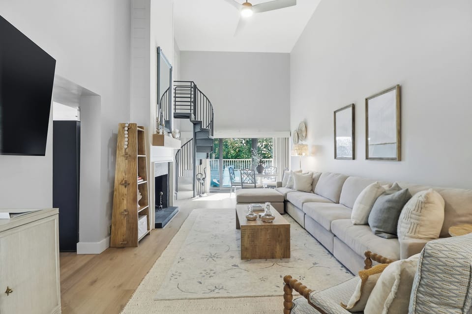 Living area with spiral stairs to the loft
