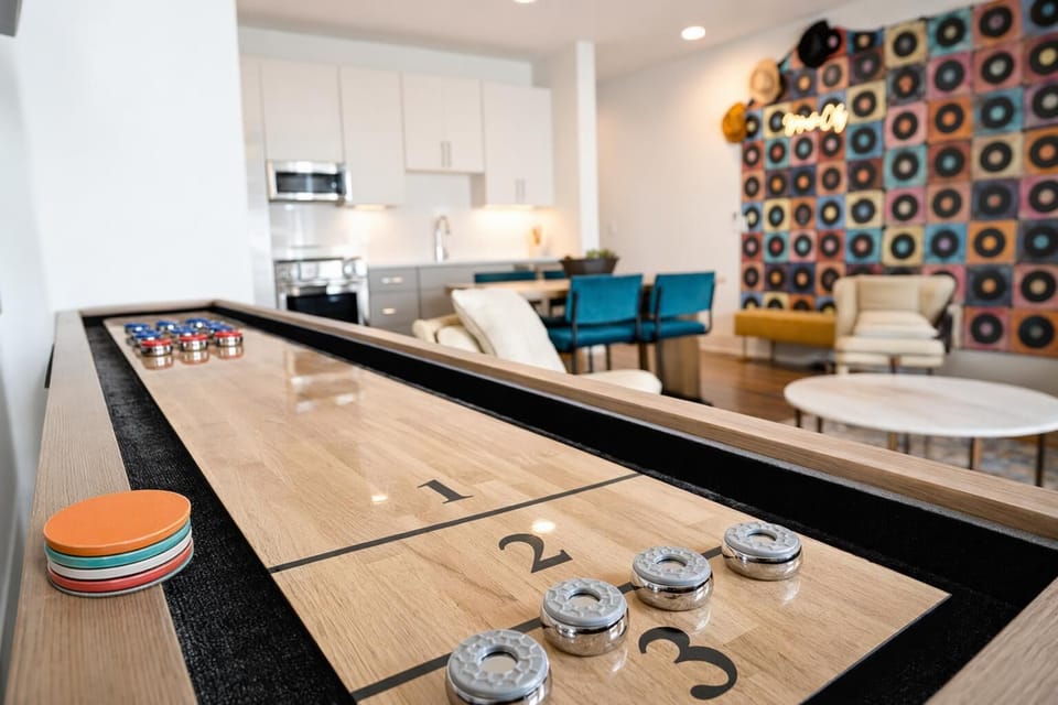 Shuffleboard table: the centerpiece of Backstage's game room, where competition and laughter happen all afternoon