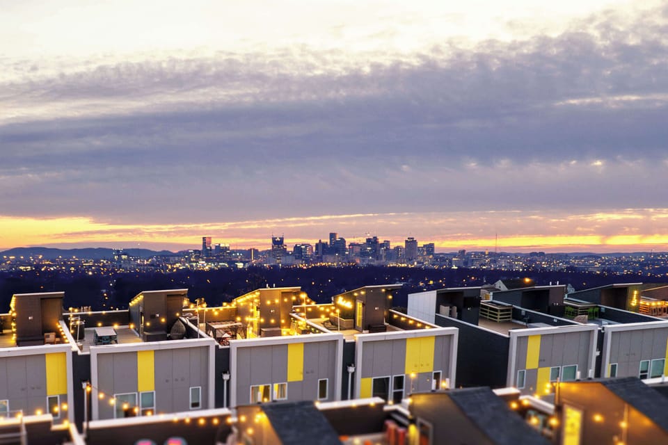 Golden hour from the rooftop, this is where the day's best conversations happen before everyone heads back downtown
