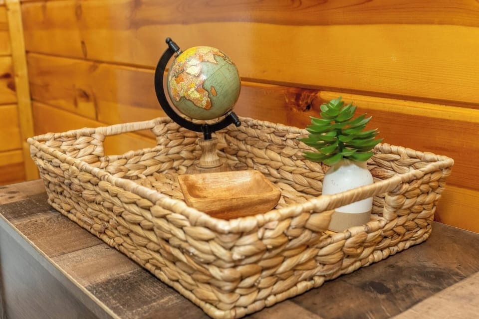 - Decorative woven basket with globe and succulent accent   - Cozy cabin styling with natural textures and wood walls   - Thoughtful rustic decor touches for a welcoming stay