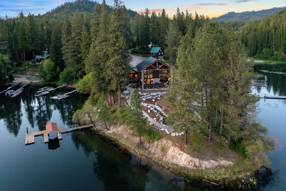 Over 1 acre or land, 500 ft of shoreline, sandy beach and private 2 slip dock