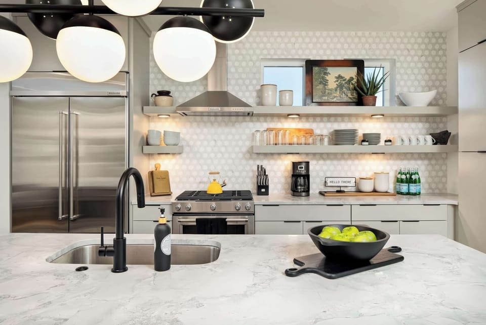 Welcome to this chic Nashville kitchen, blending modern elegance with space for culinary fun. Perfect for large groups, it's an upscale retreat where you can cook and laugh together in comfort.