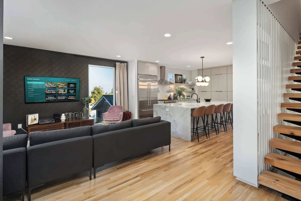 Enjoy a stylish downtown Nashville retreat perfect for large groups. The open layout features an elegant living area and gourmet kitchen, ideal for family reunions or bachelorette parties. Unwind over drinks at the chic island or relax in luxury—your Nashville getaway starts here!