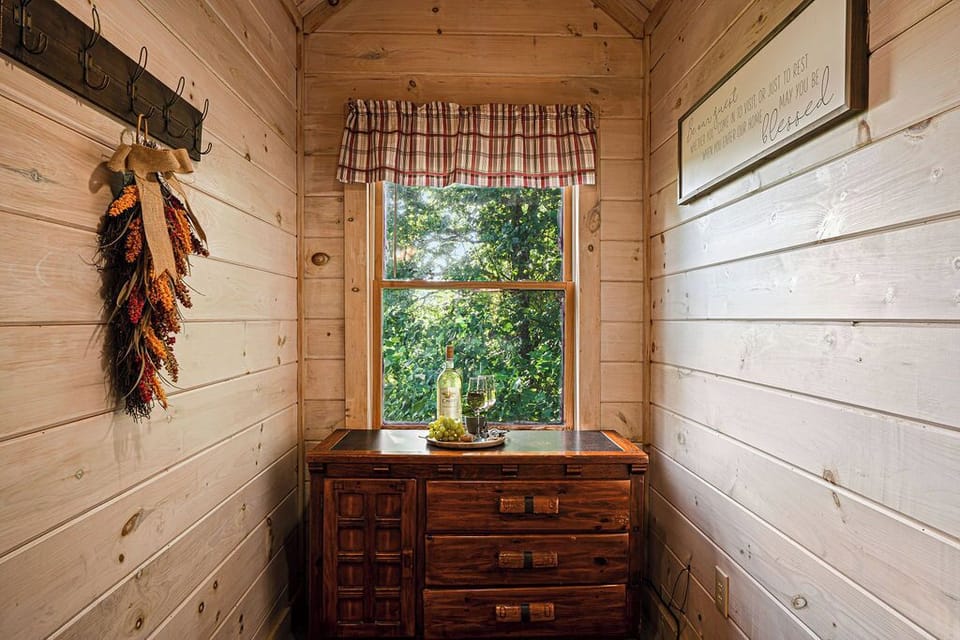 Charming cabin nook with rustic wood accents and peaceful leafy views