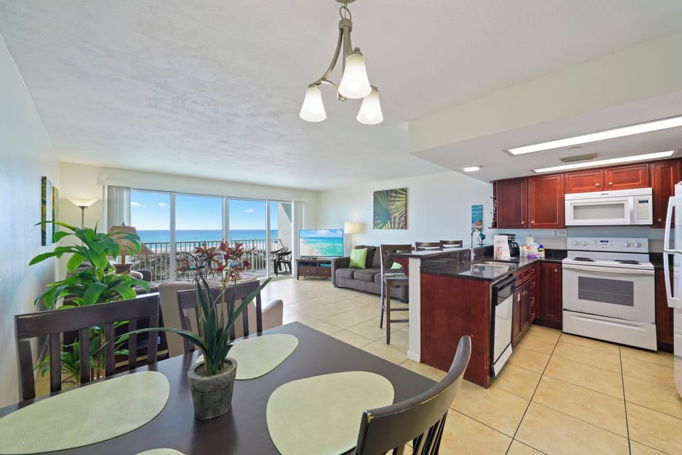 Enjoy meals with ocean views in this Cabana Club of Destin beachfront condo.