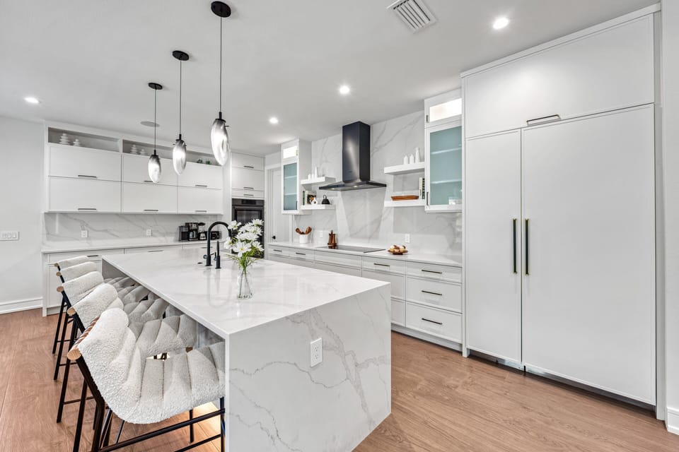 Start your mornings at the sleek kitchen island and every breakfast feels effortlessly luxurious.