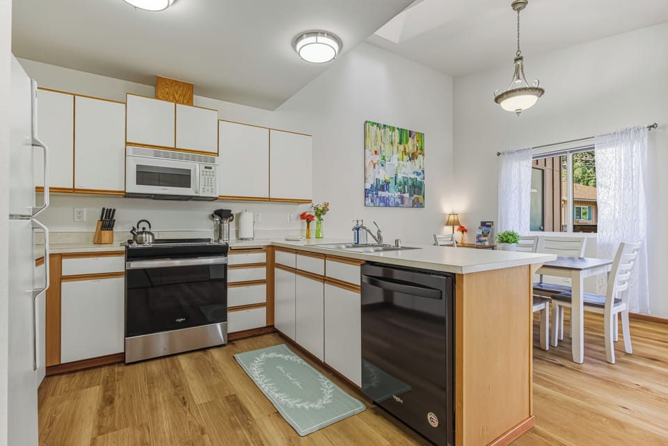 Fully stocked kitchen and dining area.  Small desk in corner for working.