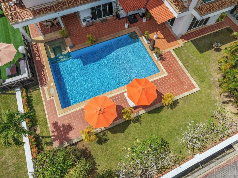 A refined luxury villa by WOW Holiday Homes with waterfront views.