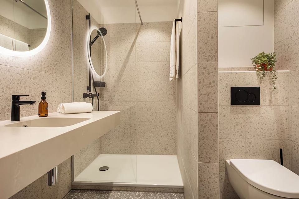 Refresh in a modern bathroom with spacious walk-in shower.