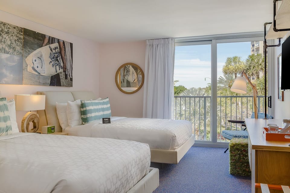 Wake up to palm views from your private balcony retreat.
