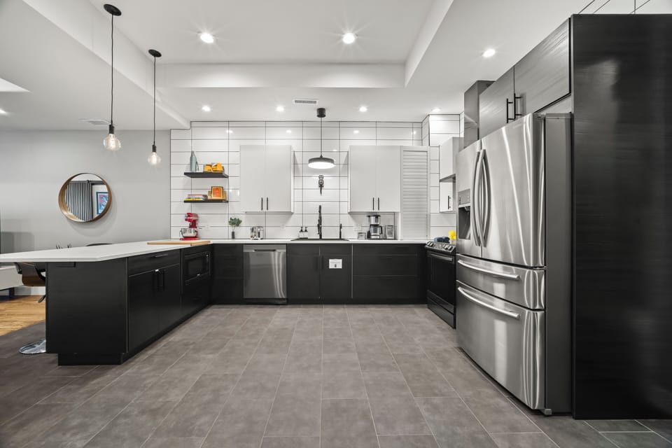 Fully equipped modern kitchen with stainless appliances, perfect for cooking and gathering together.