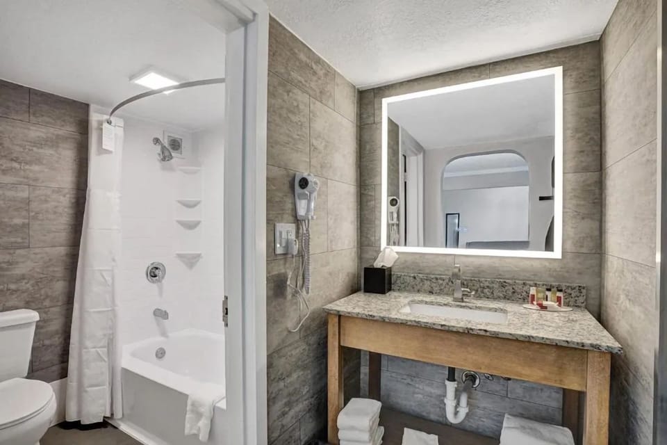 Refresh easily with a bright vanity and shower-tub combo.