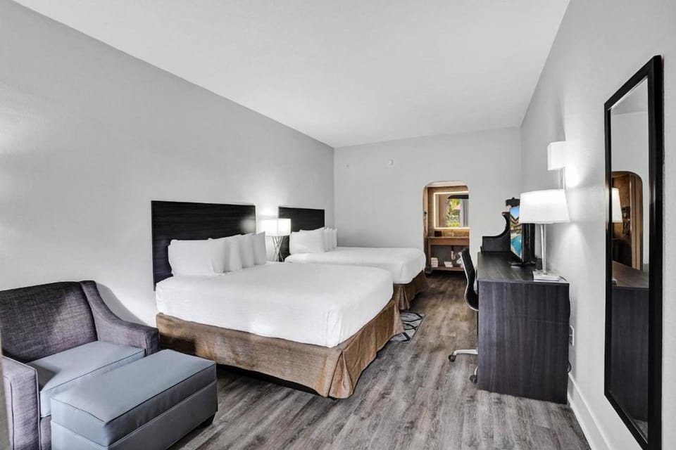 Unwind in a spacious double-queen room with crisp linens.