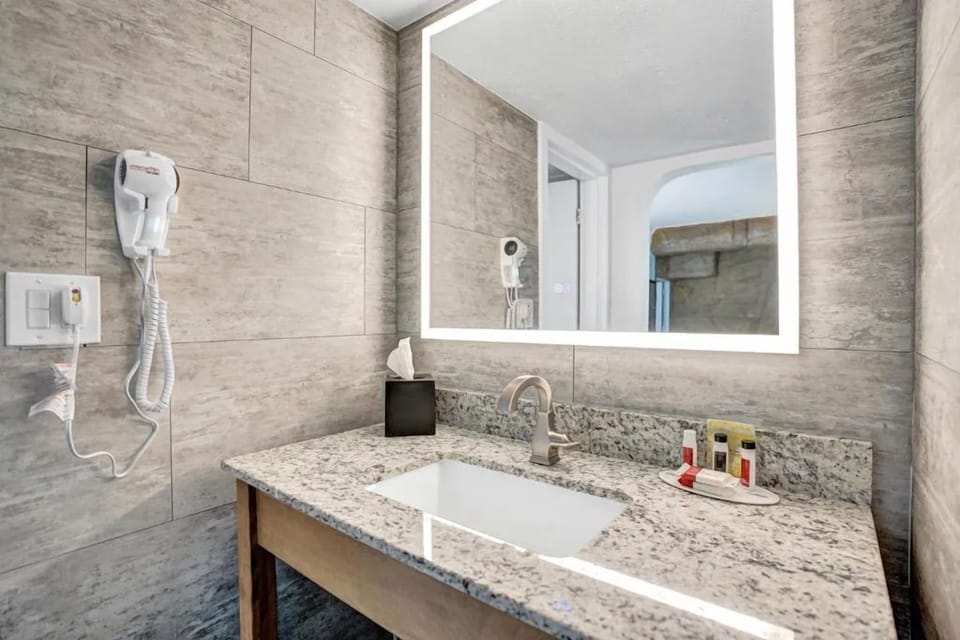 Pamper yourself at a well-lit mirror with premium countertop space.
